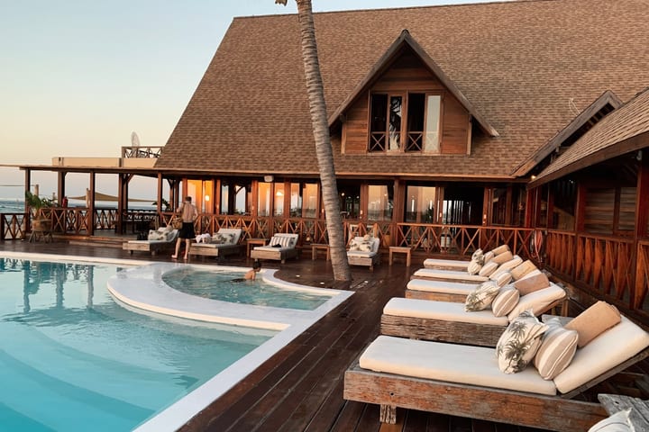 Resort-style pool and hotel exterior — hospitality supply segment